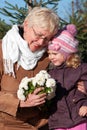 Grandmather and granddaughter in park