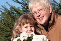 Grandmather and granddaughter in park