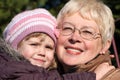 Grandmather and granddaughter in park