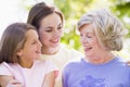 Grandmother with adult daughter and grandchild