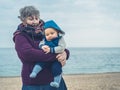 Grandmother with baby on beach