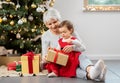 grandmother and baby girl with christmas gifts