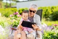 Grandmother and baby granddaughter with tablet pc Royalty Free Stock Photo