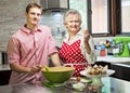 Grandmother baking cupcakes with her grandson Royalty Free Stock Photo