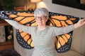 Grandmother with beautiful wings at home Royalty Free Stock Photo