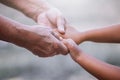 Grandmother and child little girl holding hand together Royalty Free Stock Photo