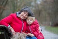 Grandmother and child in the park on a winter day, enjoying time together Royalty Free Stock Photo