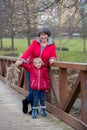 Grandmother and child in the park on a winter day, enjoying time together Royalty Free Stock Photo