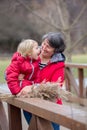 Grandmother and child in the park on a winter day, enjoying time together Royalty Free Stock Photo