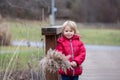 Grandmother and child in the park on a winter day, enjoying time together Royalty Free Stock Photo