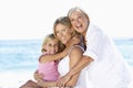 Grandmother With Daughter And Granddaughter Embracing On Beach Holiday Royalty Free Stock Photo