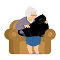 Grandmother and fat cat sitting on chair. granny cat lady. Royalty Free Stock Photo