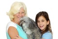 Grandmother and girl hugging the family dog Royalty Free Stock Photo