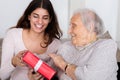 Grandmother Giving Gift To Her Granddaughter Royalty Free Stock Photo