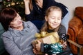 Grandmother giving her granddaughter Christmas gift Royalty Free Stock Photo