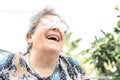 Grandmother with glasses and gray hair very happy smiling with denture Royalty Free Stock Photo