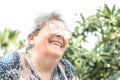 Grandmother with glasses and gray hair very happy smiling with denture Royalty Free Stock Photo