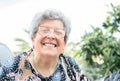 Grandmother with glasses and gray hair very happy smiling with denture Royalty Free Stock Photo