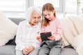 Grandmother with grandaughter using tablet Royalty Free Stock Photo