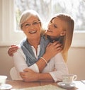 Grandmother, grandchild and happiness for bonding in portrait at nursing home with tea and conversation with love Royalty Free Stock Photo