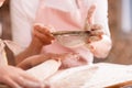 Grandmother and grandchild kneading dough