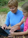 Grandmother, grandchild with laptop