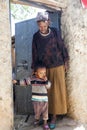 Grandmother with grandchild posing in entrance of their house in city of Jugol. Harar. Ethiopia.