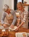 Grandmother, grandchild and together in kitchen to bake gluten free homemade pie, bonding and learning grandma recipe Royalty Free Stock Photo