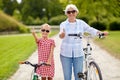 Grandmother and granddaughter with bicycles Royalty Free Stock Photo