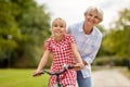 Grandmother and granddaughter with bicycles Royalty Free Stock Photo