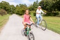 Grandmother and granddaughter cycling at park Royalty Free Stock Photo