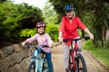 Grandmother and granddaughter cycling in park Royalty Free Stock Photo