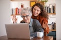 Grandmother and granddaughter doing video call with laptop Royalty Free Stock Photo