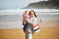 Grandmother and granddaughter enjoying Atlantic ocean on the beach Royalty Free Stock Photo