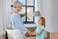 Grandmother and granddaughter holding hands Royalty Free Stock Photo