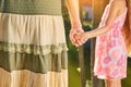 Grandmother with granddaughter holding hands. Royalty Free Stock Photo