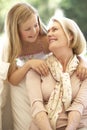 Grandmother With Granddaughter Laughing Together On Sofa Royalty Free Stock Photo