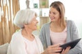 grandmother and granddaughter looking at tablet computer Royalty Free Stock Photo
