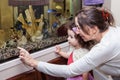 Grandmother and granddaughter near aquarium