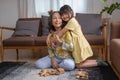 Grandmother and granddaughter play games. Blockwood Puzzle To develop skills for granddaughter and as a holiday activity