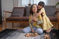 Grandmother and granddaughter play games. Blockwood Puzzle To develop skills for granddaughter and as a holiday activity