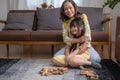 Grandmother and granddaughter play games. Blockwood Puzzle To develop skills for granddaughter and as a holiday activity