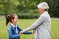 Grandmother and granddaughter playing at park Royalty Free Stock Photo