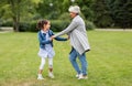 Grandmother and granddaughter playing at park Royalty Free Stock Photo