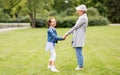 Grandmother and granddaughter playing at park Royalty Free Stock Photo