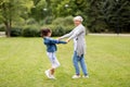 Grandmother and granddaughter playing at park Royalty Free Stock Photo