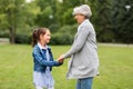 Grandmother and granddaughter playing at park Royalty Free Stock Photo