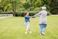 Grandmother and granddaughter playing at park Royalty Free Stock Photo