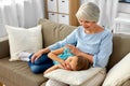 Grandmother and granddaughter resting on pillow Royalty Free Stock Photo