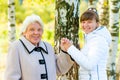 Grandmother and granddaughter walking in the park Royalty Free Stock Photo